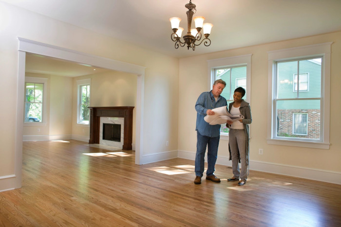 image of two people inspecting a property