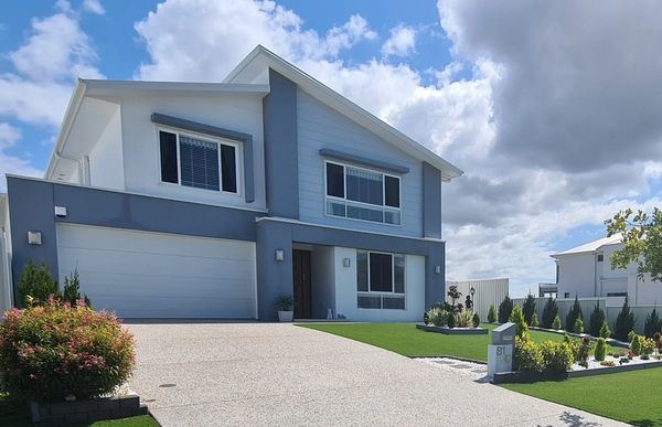 a double storey blue house