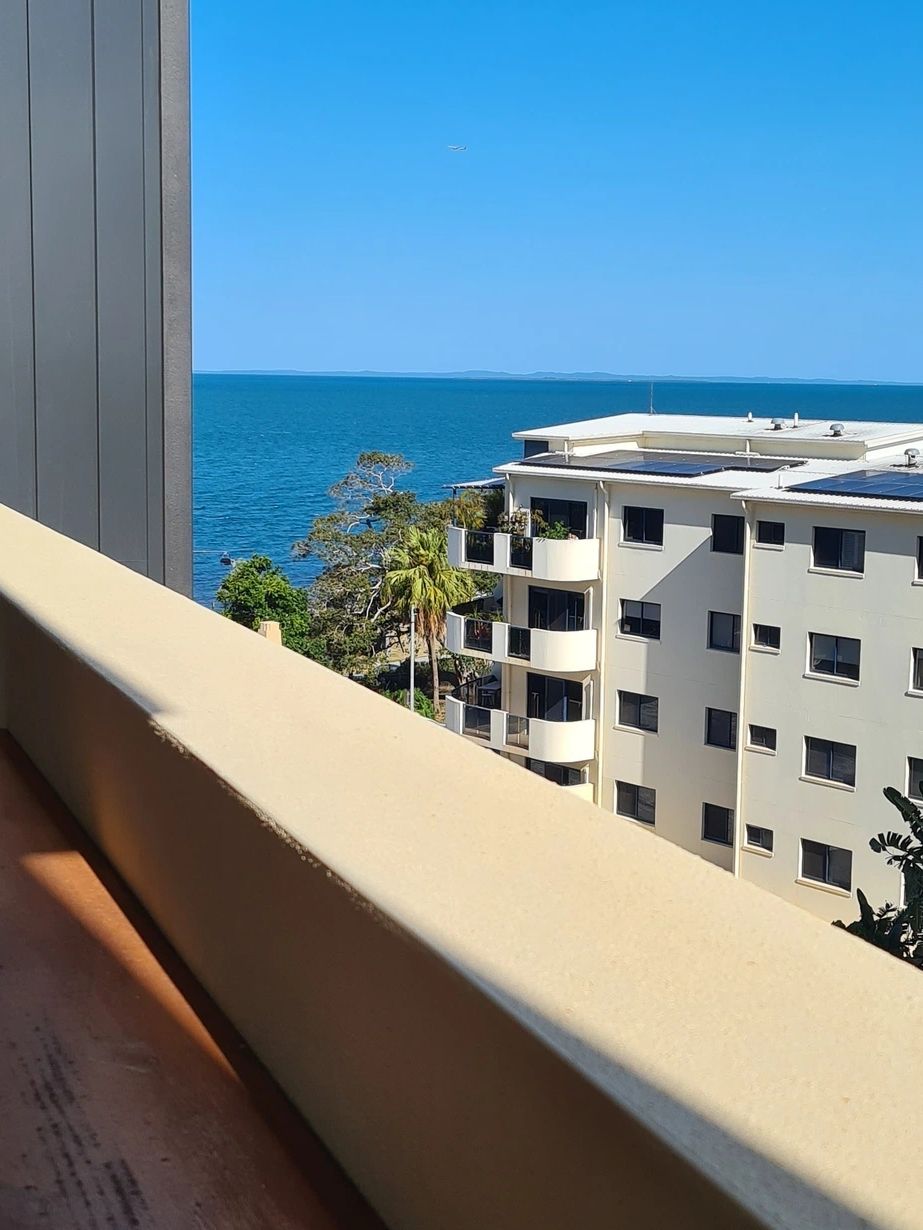 a picture of a beach from a apartment balcony