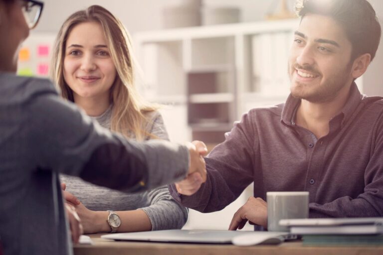 a couple talking to a buyers agent