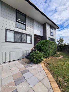 a white double storey house