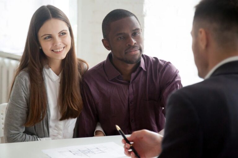 a couple having a discussion with a buyers agent