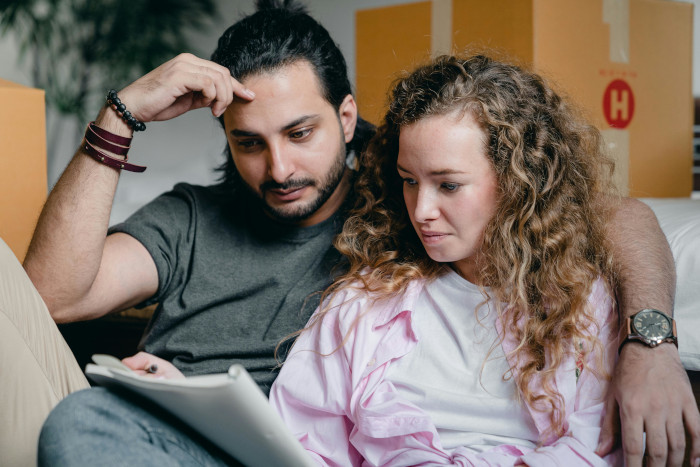 couple looking at a notebook