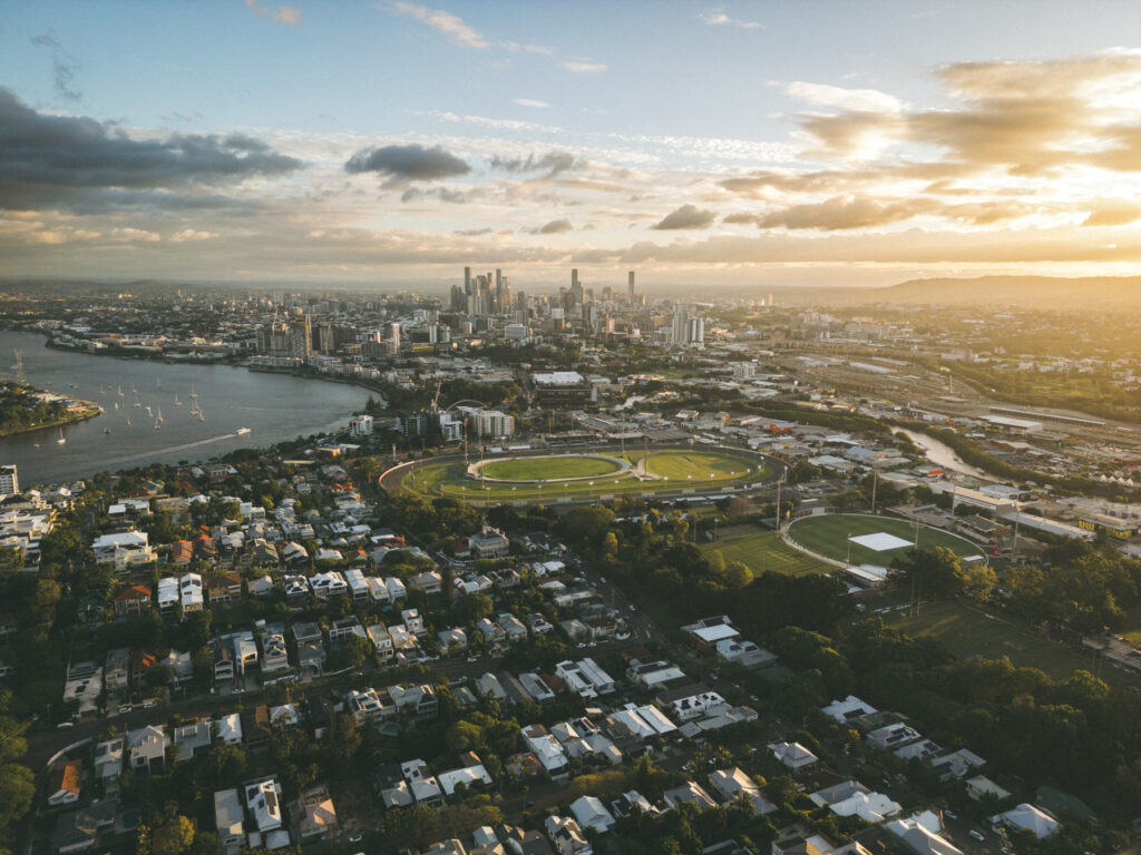 aerial view of Brisbane, Queensland at sunset with city skyline and river.